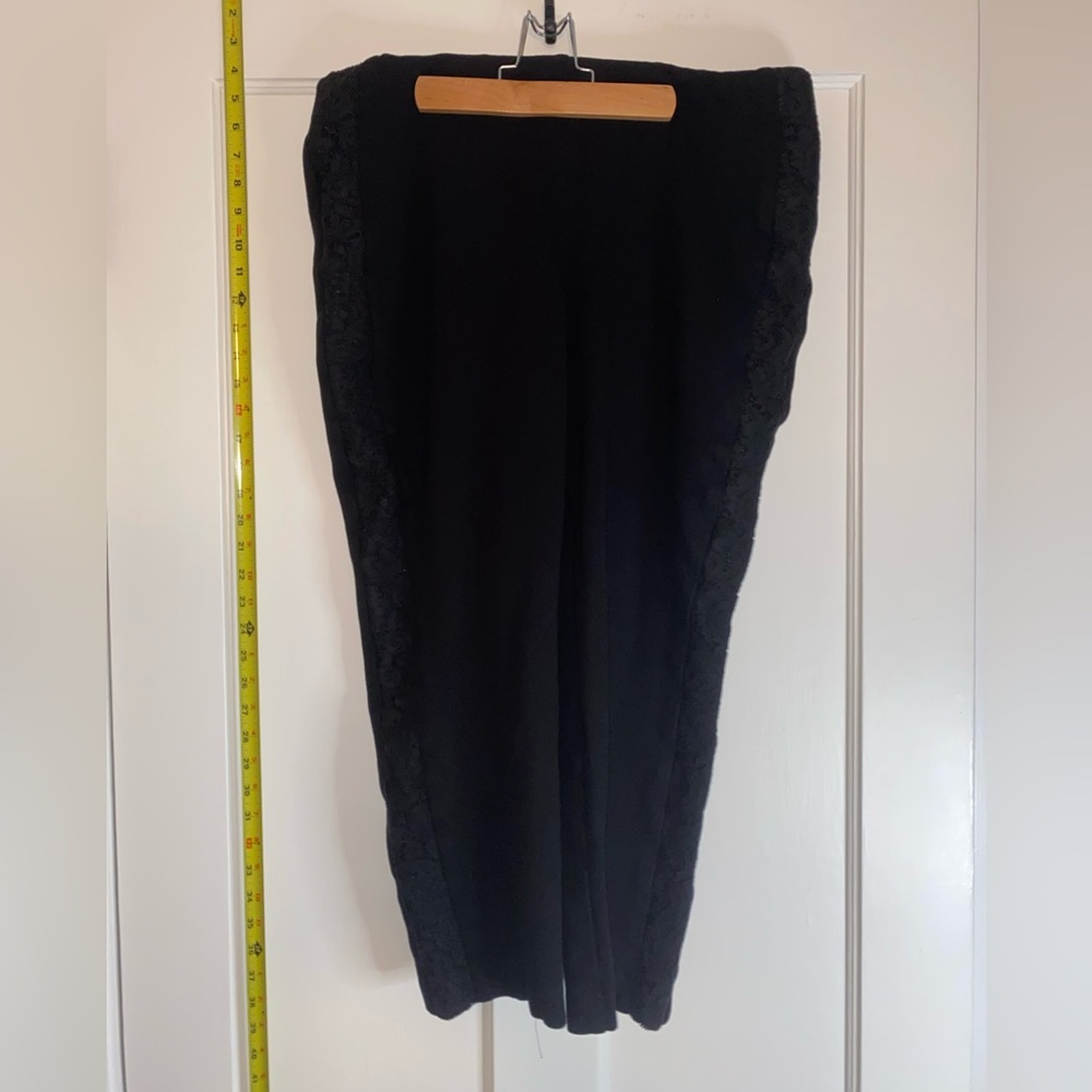 Chico’s black capri pants with floral lace design on side